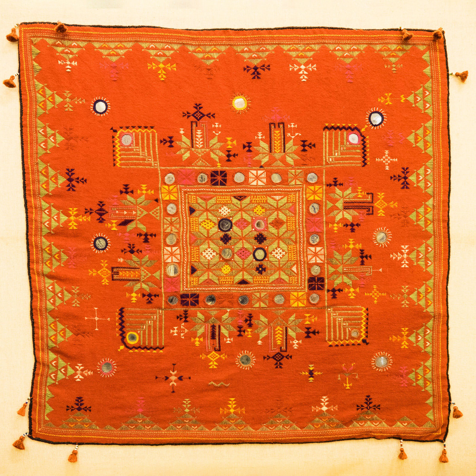 Orange cloth with intricate embroidery