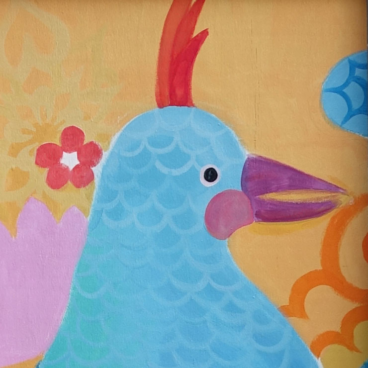 Close up on a mural of a colorful bird