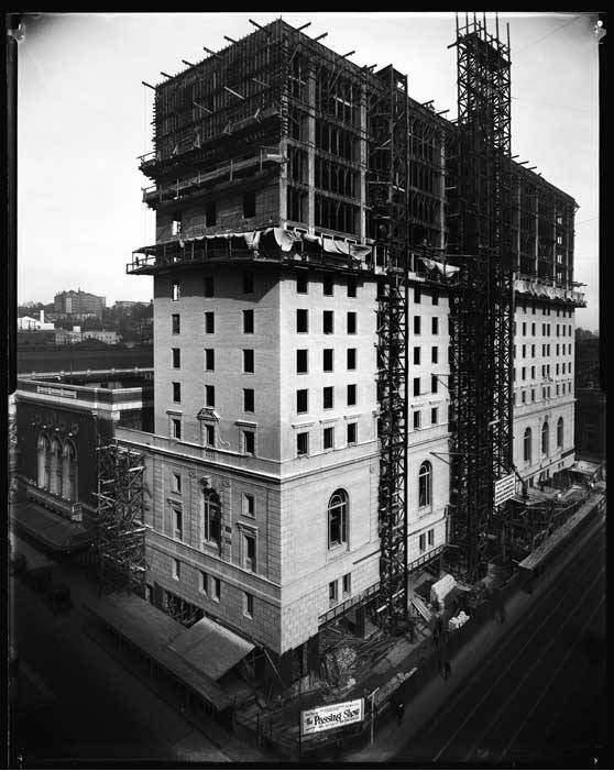 An old photo scan shows a half-gutted hotel in black and white.