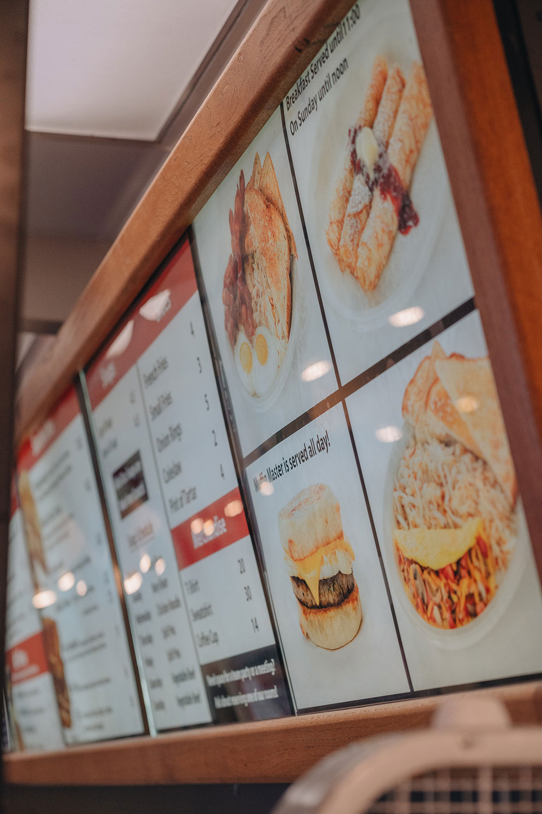 A closeup on the menu at Burgermaster shows breakfast favorites like crepes, eggs and toast.