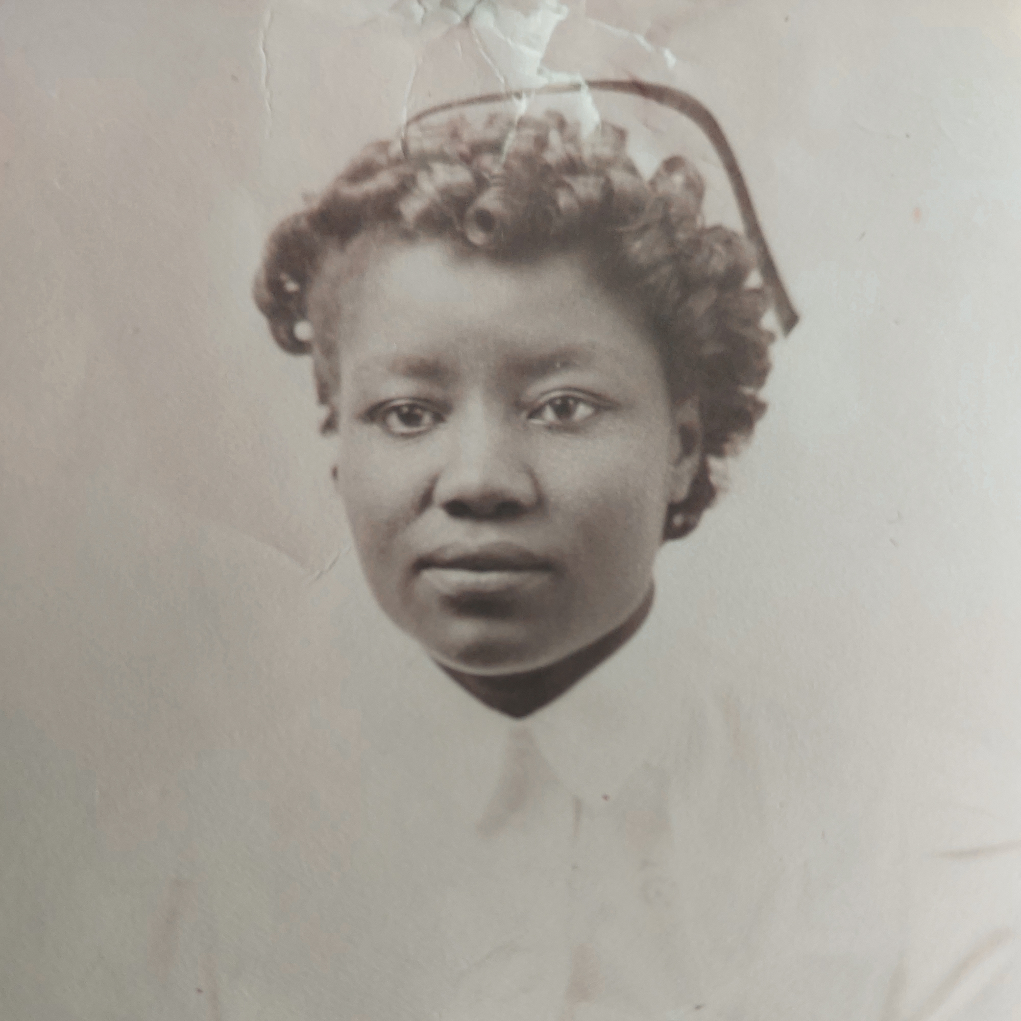 Sepia toned film headshot of Rachel Suggs Pitts in a nursing uniform