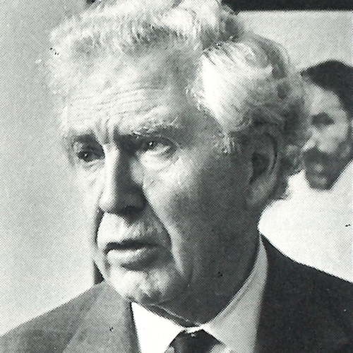 Headshot of Giovanni Costigan from the neck up wearing a suit and tie