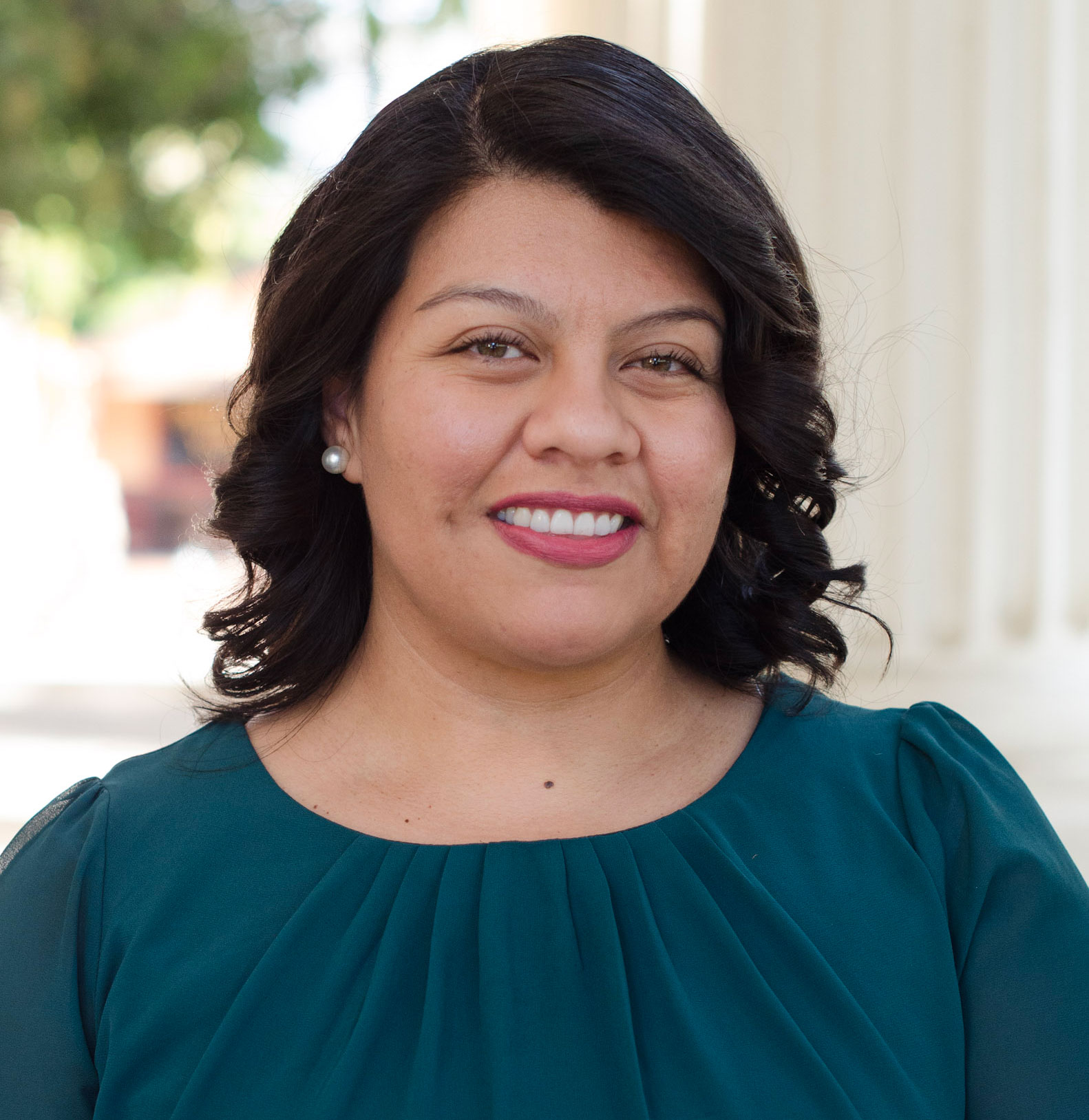 Headshot of Angelica Amezcua wearing a teal shirt