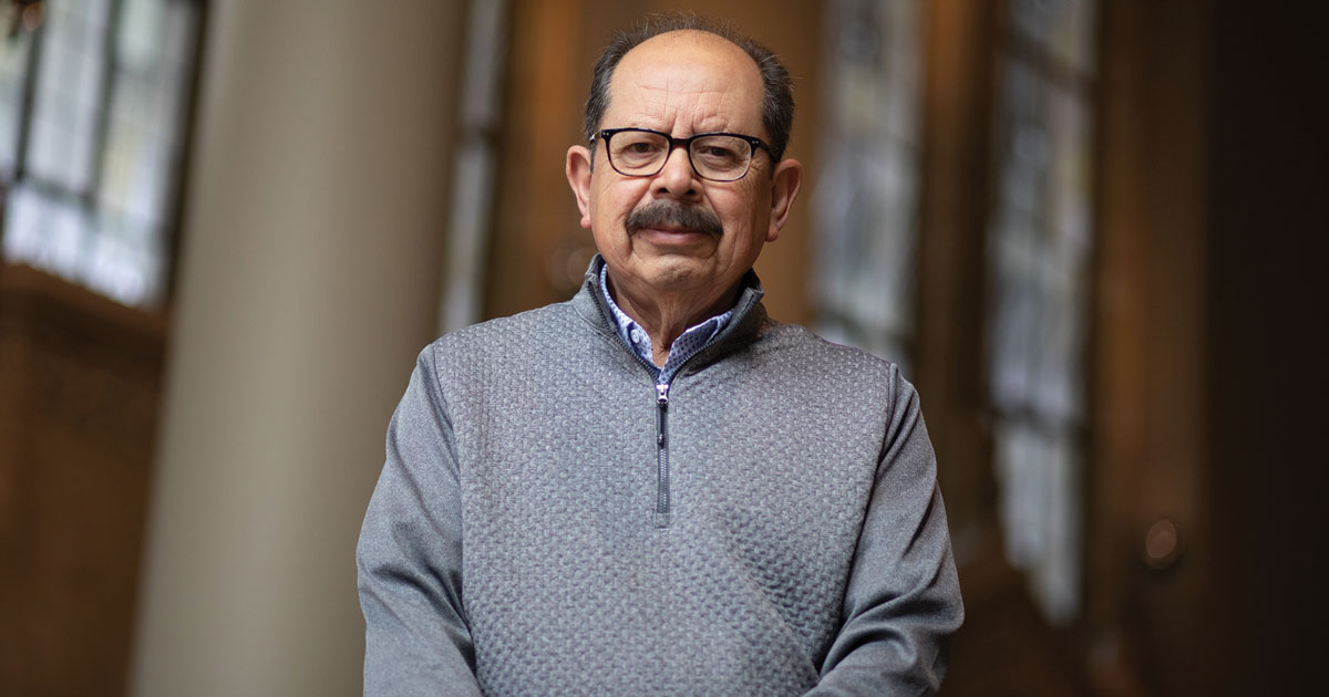 Portrait of Erasmo Gamboa wearing glasses and a grey sweater