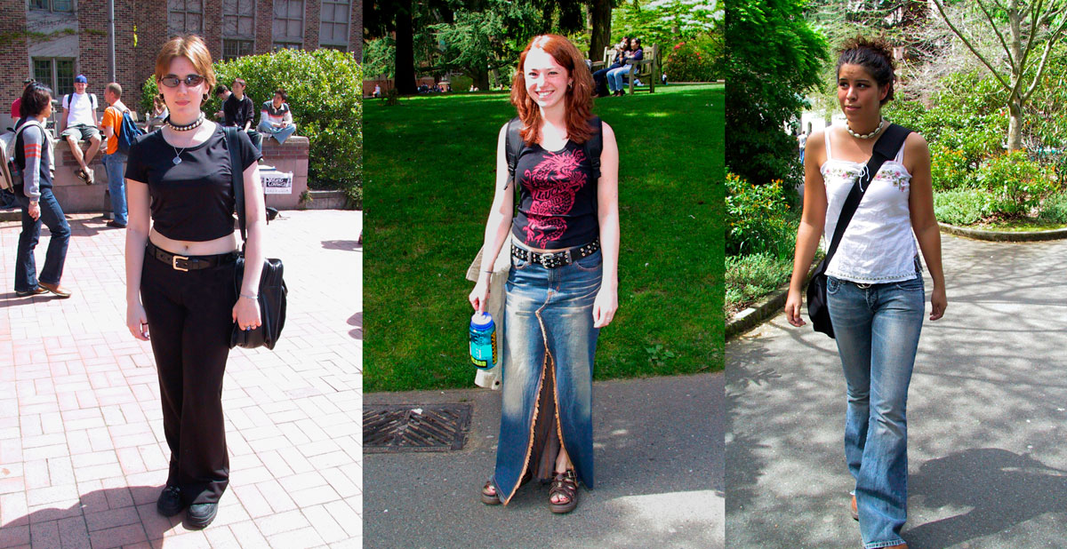 Three women pose for photos. A woman with short red hair wears a black crop top and black jeans. A woman with long dyed red hair wears a long denim maxi skirt and studded belt with a black and red tank top. A third woman wears flared jeans and a white camisole.