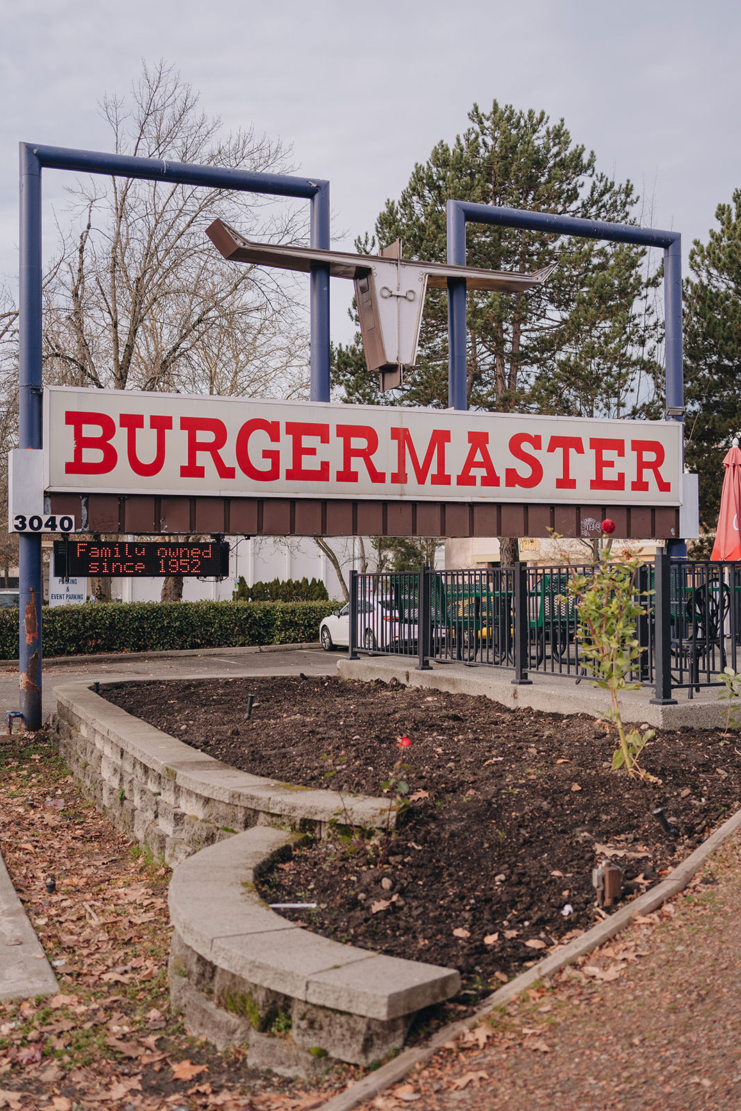 The red, white and blue Burgermaster sign in the U District, with a message board reading "Family owned since 1952"