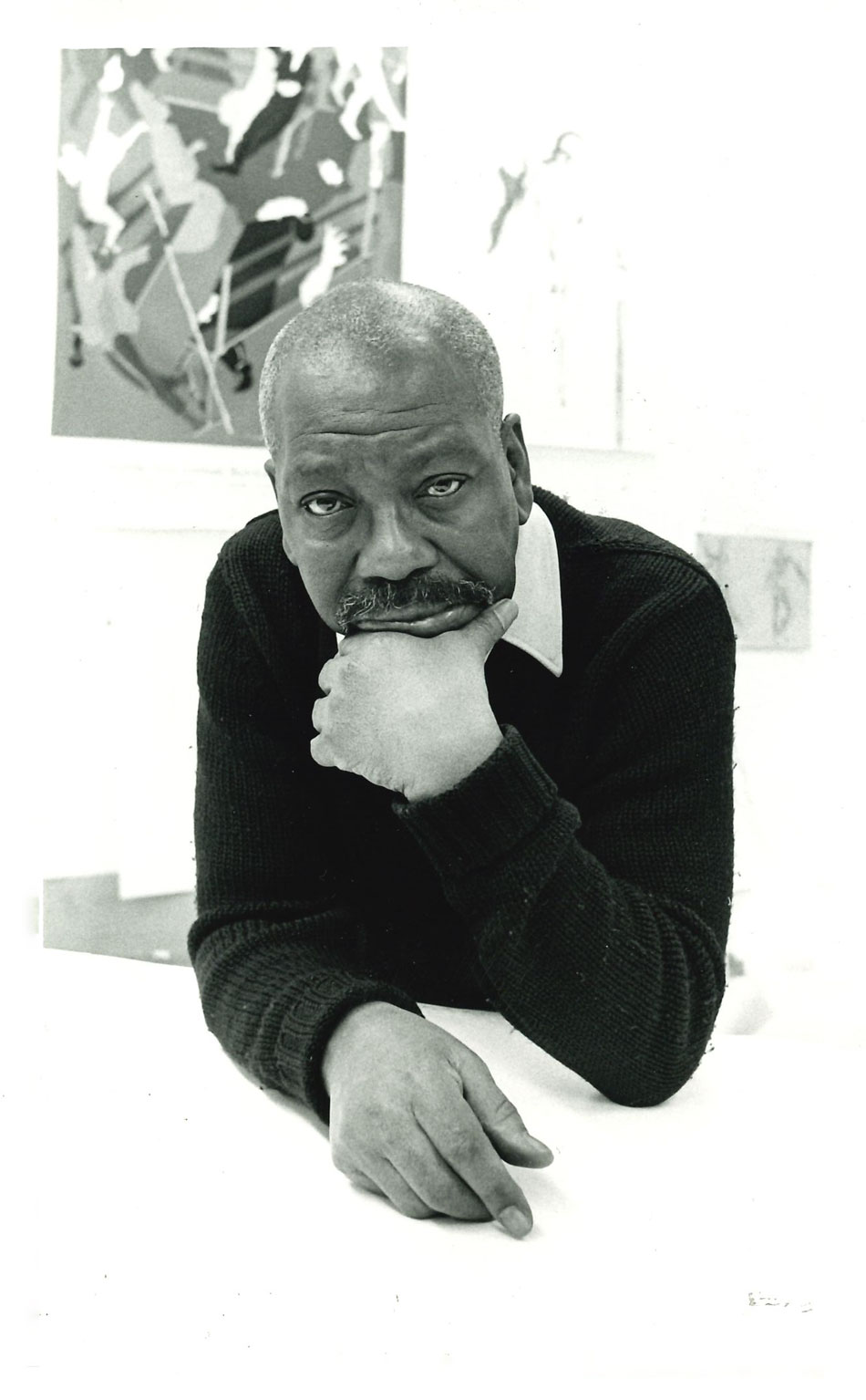 Jacob Lawrence poses in his studio