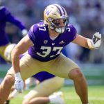 A football player wearing purple and gold